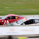 Robb waves down the main straight as he passes some friends in a B-Spec Mazda2.